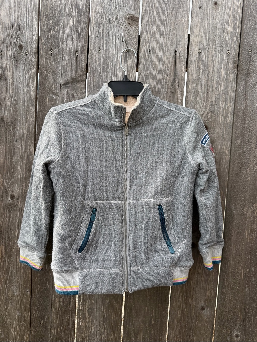 Size 8 Peek Grey Sherpa Jacket with patches. Good Used condition